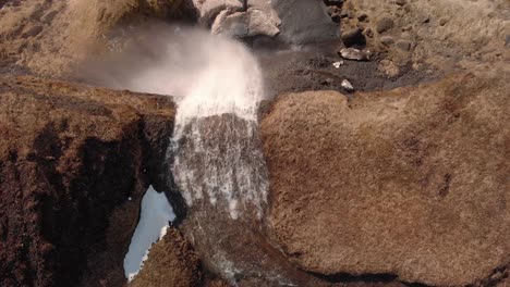 drone aerial of a waterfall in southern iceland