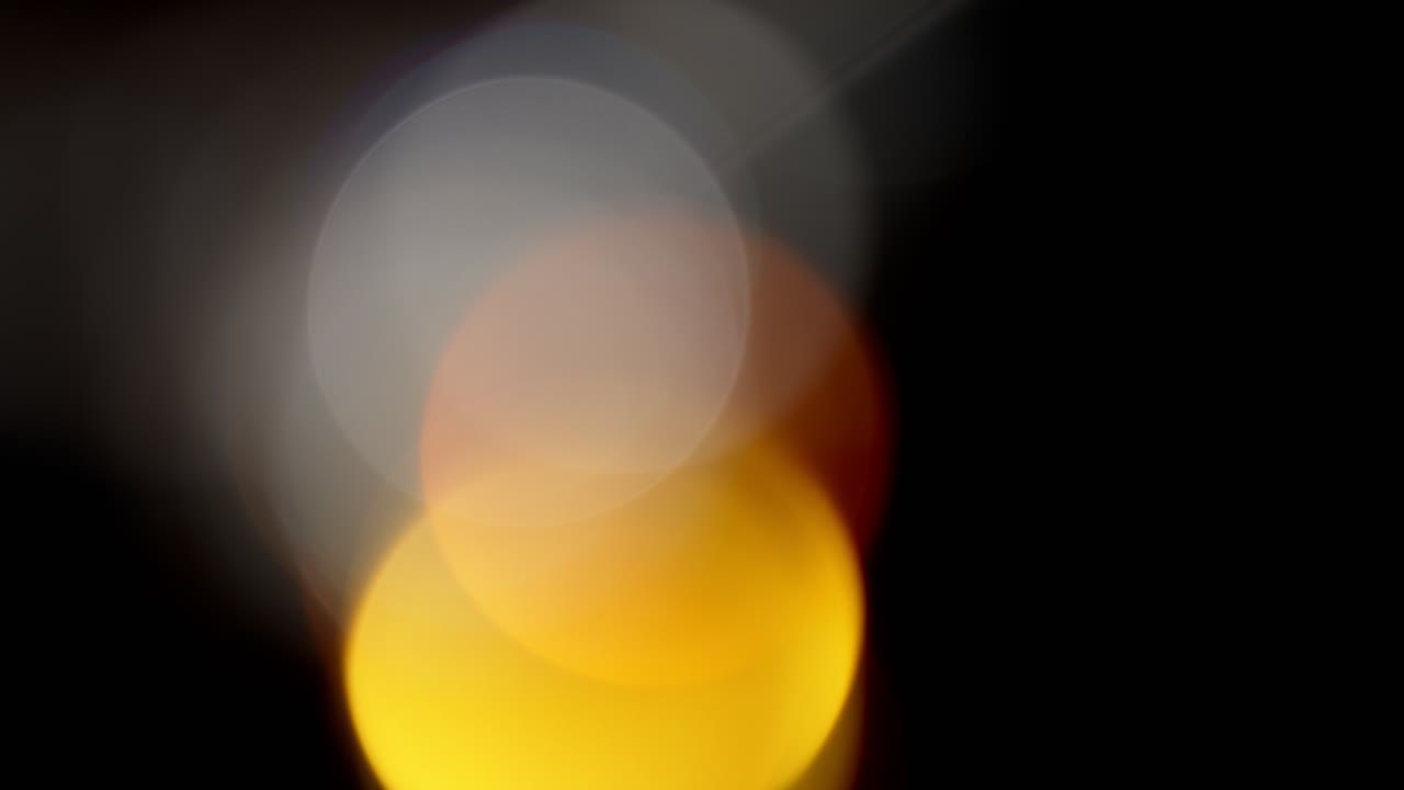 Multicolored light leaks 4k footage on black background, Stylizing video, transitions, Bokeh effect