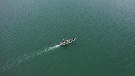 recreational fishing vessel speeding to fishing location, aerial shot