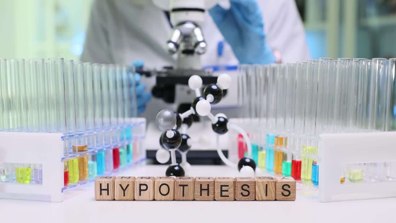 Laboratory setup with 'HYPOTHESIS' blocks, test tubes, and a scientist