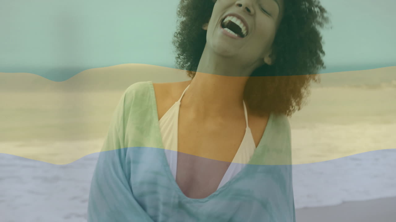 At beach, woman smiling with colorful wave animation overlay in background