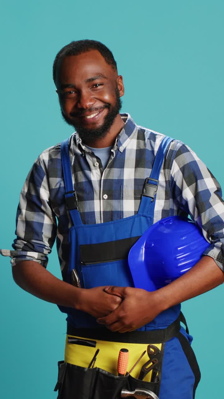 Vertical video: African american craftsman being humble saying hello