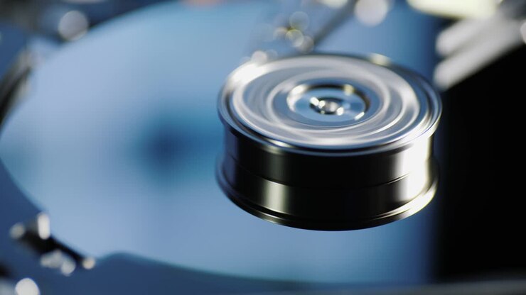 Computer running hard drive. Information from the monitor is reflected in the plates of the disk. Day center concept