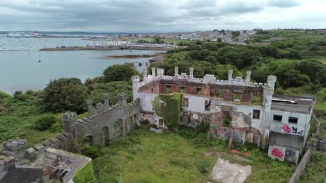 neglected mental health hospital remains aerial view flying over north wales coastal landmark