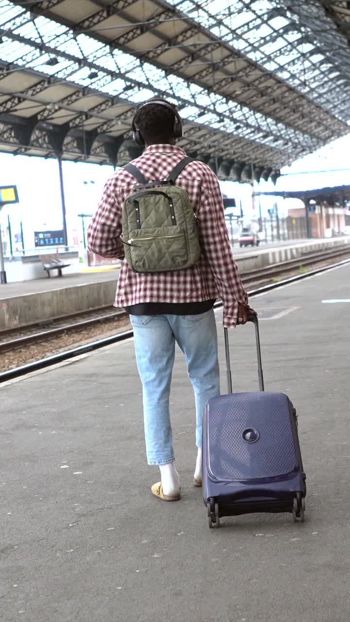 A traveler at a train station