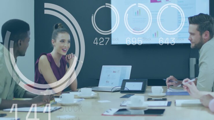 Animation of data processing against diverse colleagues discussing in meeting room at office