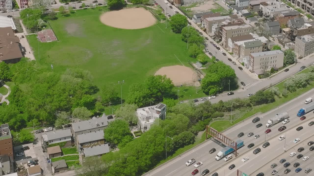 Busy highway and green park in Chicago captured from above