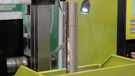 EDM CNC machine while cutting the sample work pieces. Cutting metal modern processing technology Making Industrial Details.