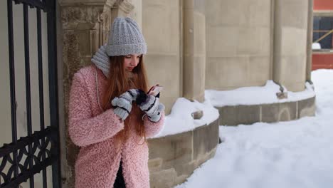 Tourist-woman-walking-in-city,-holding-mobile-phone,-looking-for-route-using-mobile-map-application