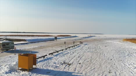 drone shot of Ice roads in Estonia during the winter snow with blue sky's
