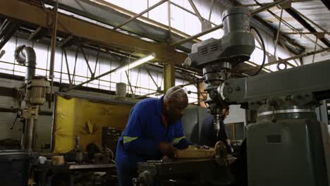 metalsmith working in workshop 4k