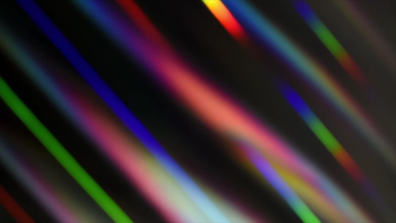 Strisce di luce astratte e colorate in movimento su sfondo scuro
