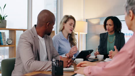 business meeting: a group of diverse colleagues having a discussion in an office meeting room