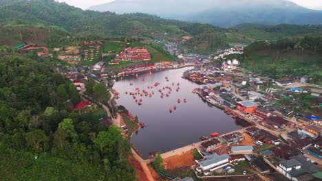 aerial ascend establishing of ban rak thai village, thailand, scenic beauty with lakes, mountains, and tea fields