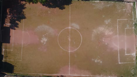 Aerial-landscape-image-of-favela-football-field---Flying-over-slum-in-district-of-Capão-Redondo,-São-Paulo-City-in-Brazil