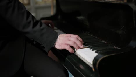 pianist hand playing piano during a concert