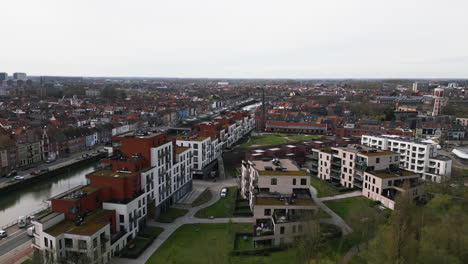 Ghent-cityscape-on-moody-cloudy-day,-aerial-drone-view