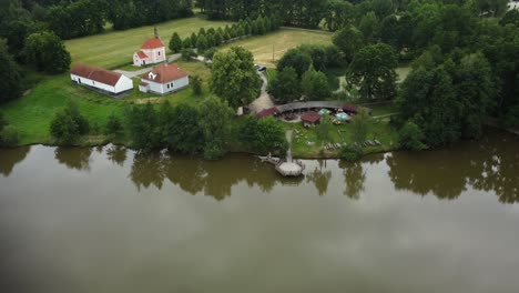 a small settlement with a chapel by the farm pond