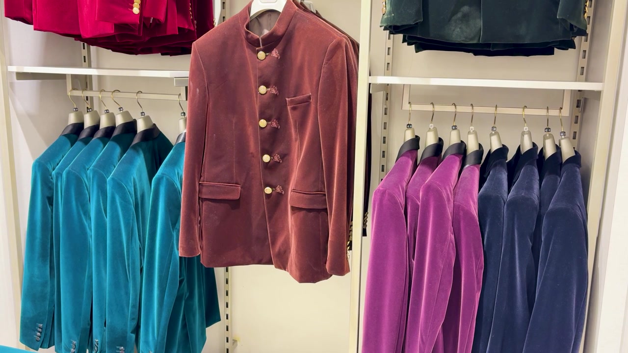 Colorful Velvet Sherwani Jackets Displayed On Clothing Rack In Fashion Boutique