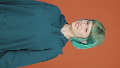 vertical video of the young woman is disgusted.