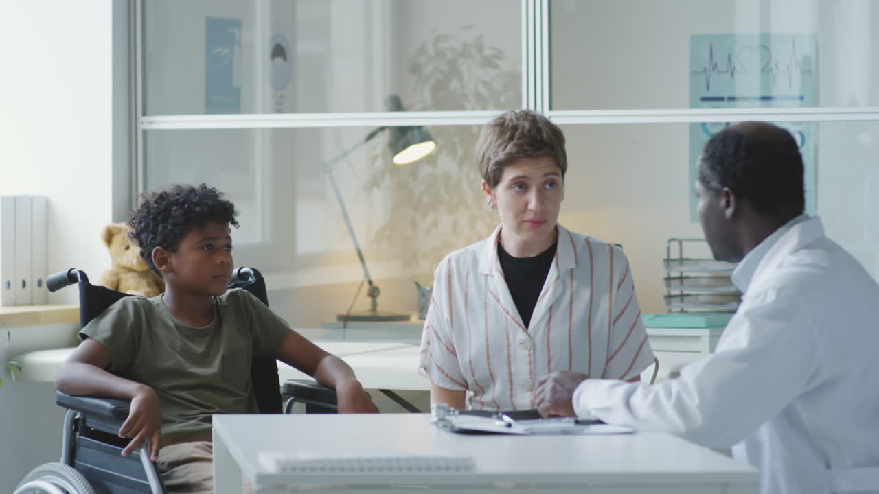 Doctor consulting with child and mother