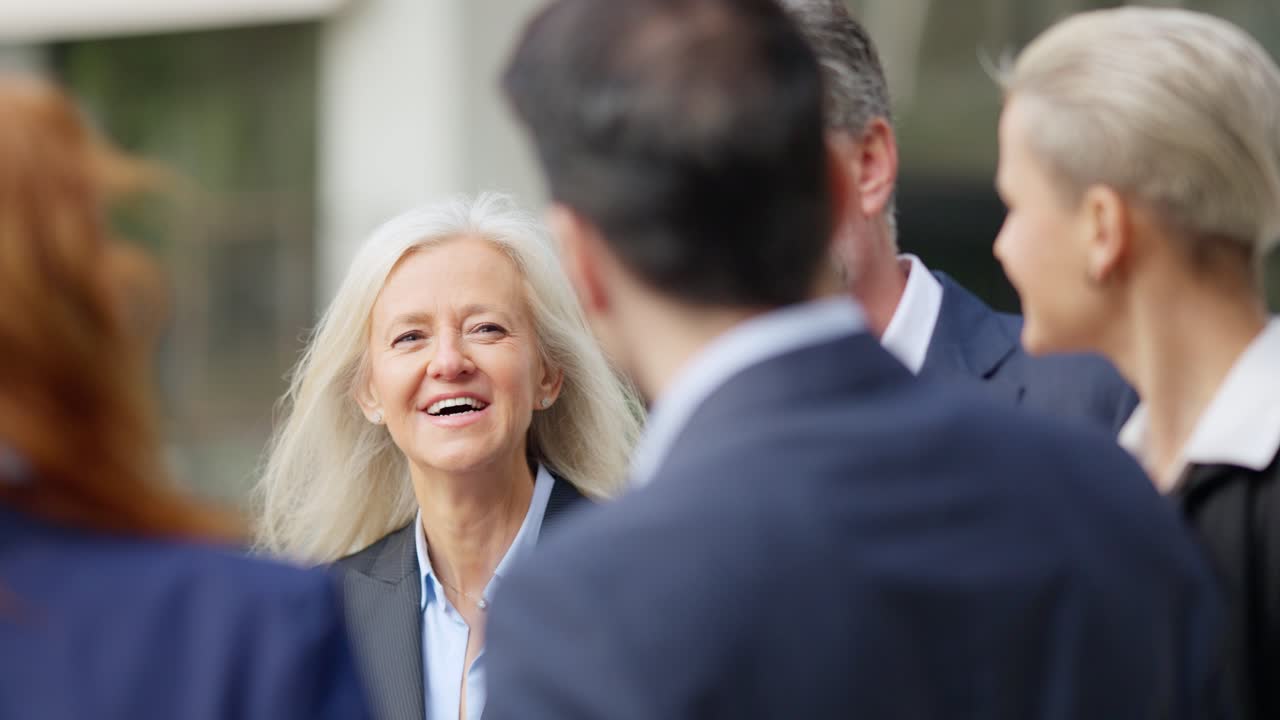 Business Professionals Engaged in Outdoor Conversation
