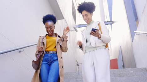 Women-friends,-happy-and-walk-on-stairs-in-city