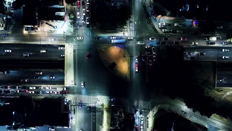 flying over main highway in mexico city at night time, residential area view