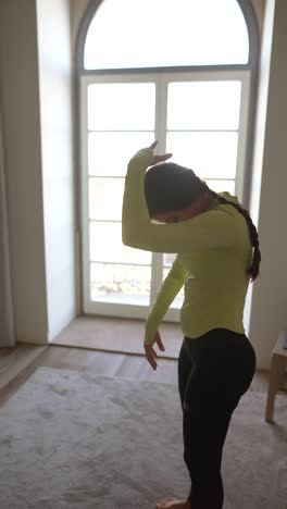 woman stretching at home