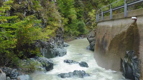 Aerial-Following-Flow-Of-Drava-River-In-Eisenkappel-Vellach