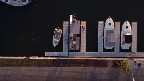 Top-Down-Aerial-view-of-tourists-on-a-yacht-or-boat-at-a-port-harbour-of-Pira-Pytá-in-Posadas-Argentina