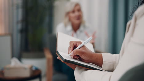 therapist taking notes during a session