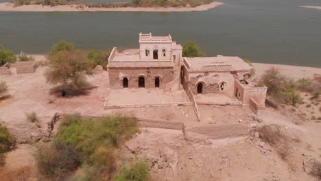 ruined house in the middle of the desert in chotiari dam from the sanghar town in sanghar district, sindh, pakistan