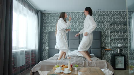 happy couple dancing in hotel room
