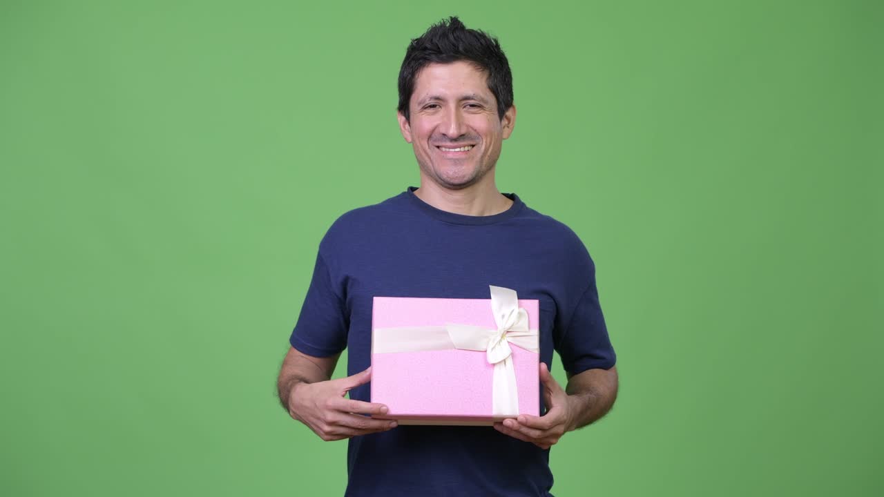 Happy Hispanic man with gift box