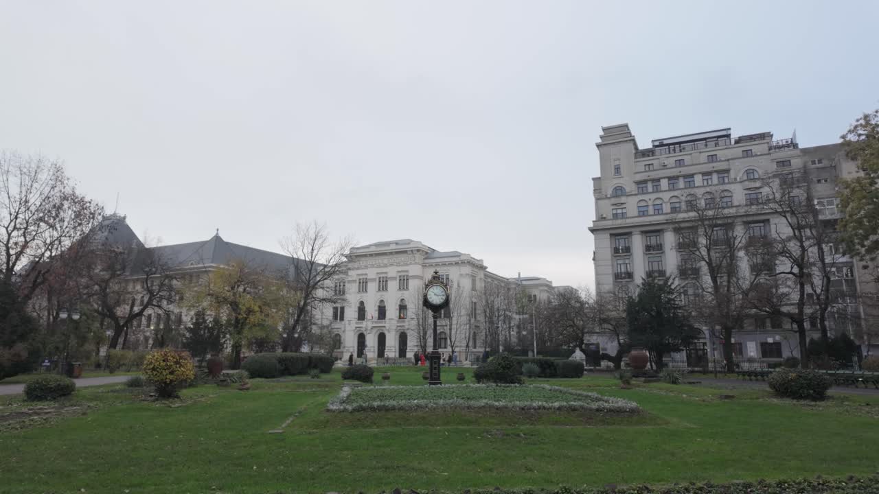 Quiet autumn scene featuring The Clock of Cișmigiu and classic Bucharest architecture