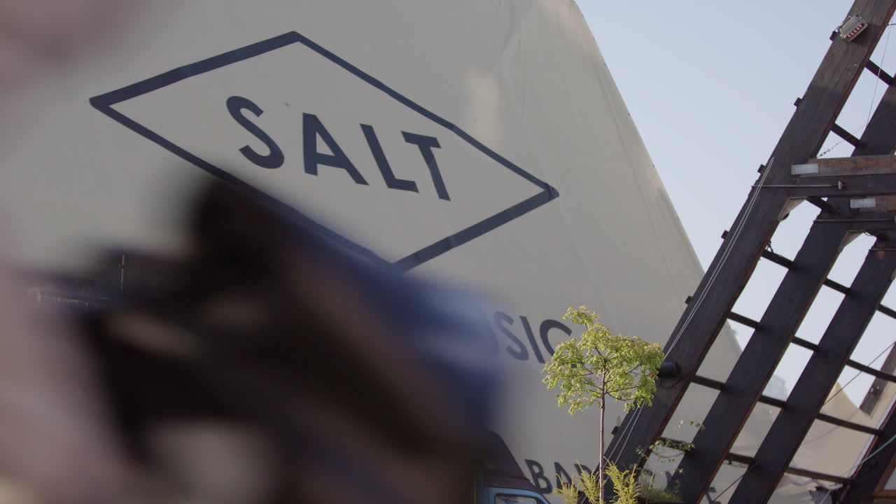 Pedestrians and cyclists pass the Salt music and arts venue in Oslo