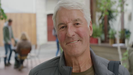 close up portrait of cheerful elderly caucasian man smiling happy looking at camera enjoying relaxed retirement confident satisfaction