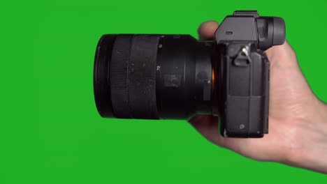 professional dslr photo camera with lens at green background. chroma key