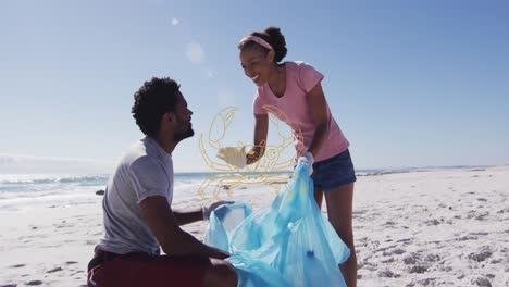 animación de cáncer sobre un hombre y una mujer afroamericanos sonrientes recogiendo basura en la playa