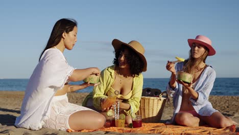 women having a picnic on the beach