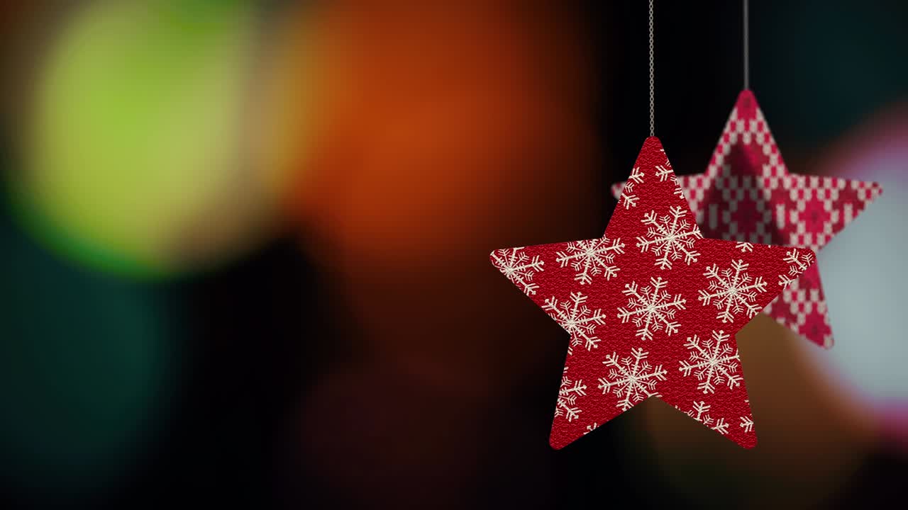 los adornos de las estrellas de navidad se mueven en el fondo de bokeh.