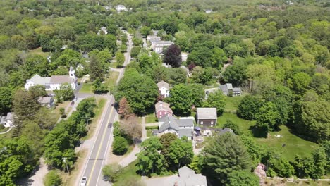 aerial angled view over hingham neighborhood while moving sideways in a r to l trucking motion