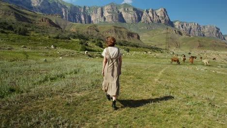 woman walking in a mountain valley