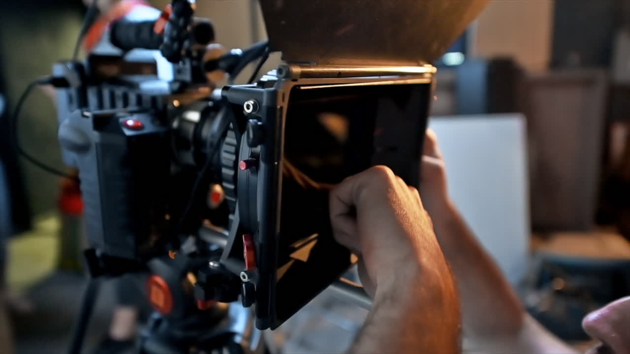 The cameraman working with a professional camera on the set in a studio