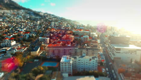 Lens-flare,-aerial-drone-view-of-urban-city