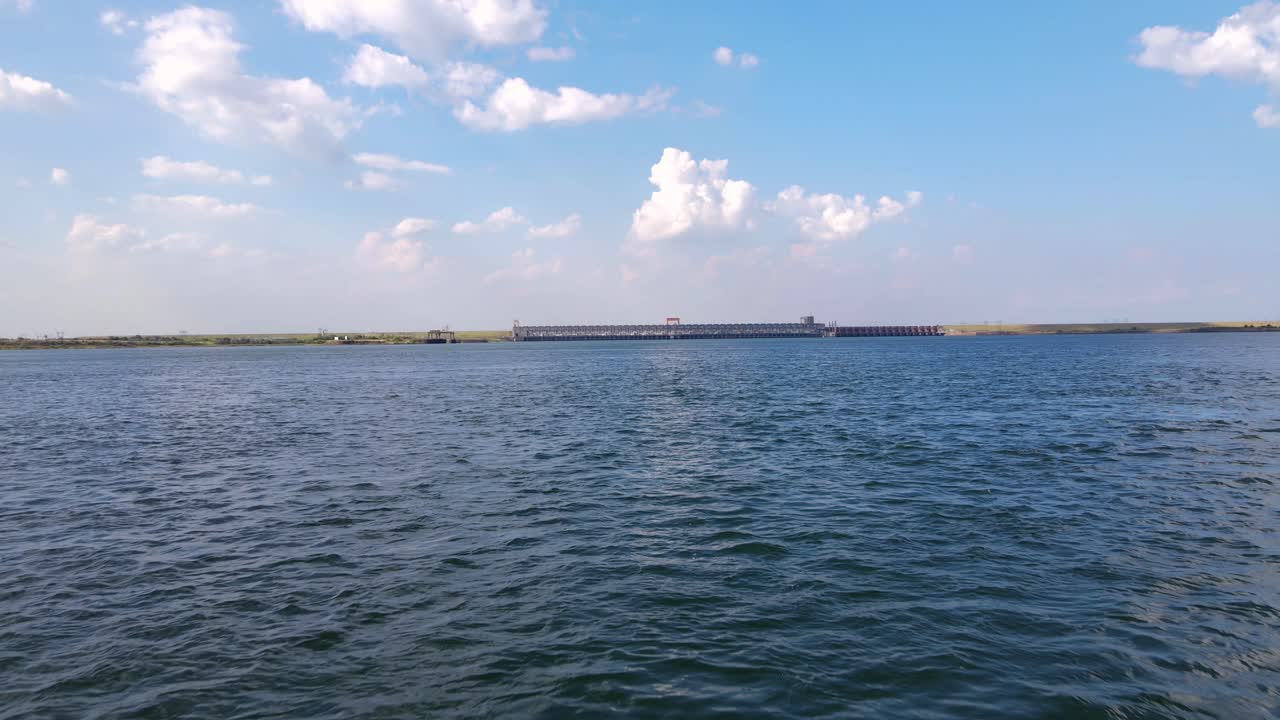 Drone shot flying close to the water of the R&iacute;o Paran&aacute; towards the hydroelectric dam between Argentina and Paraguay, &amp;quot;Represa Yacret&aacute;&amp;quot;
