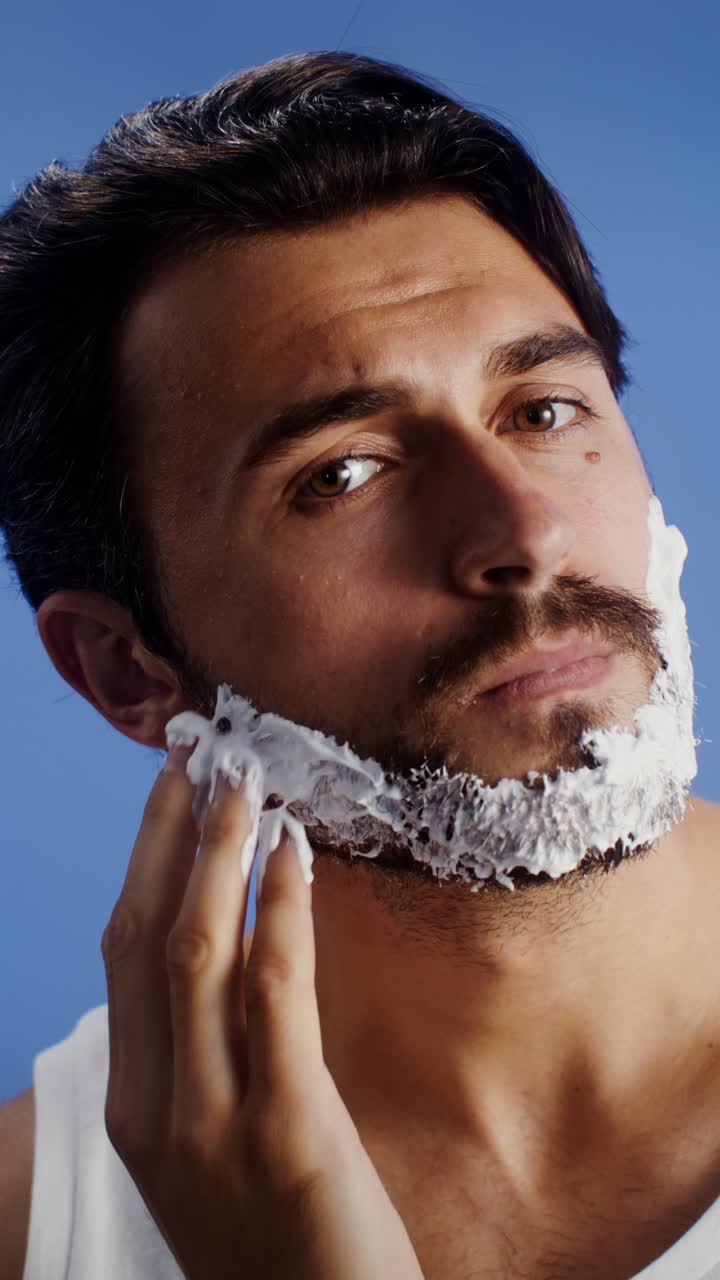Man applying shaving cream