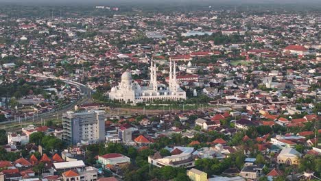 majestic great mosque in surakarta, indonesia. aerial birds eye of big indonesian city in central java.