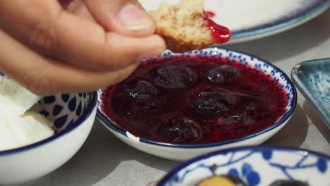 delicious homemade berry jam with bread and yogurt for breakfast